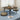Square folding coffee table with dark brown wood top and black frame