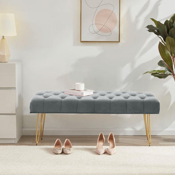 Tufted velvet bench with button detailing, gray upholstery and gold hairpin legs