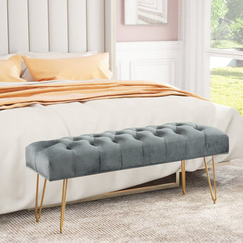 Upholstered button-tufted velvet bench in gray with gold hairpin legs