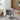 Velvet upholstered storage ottoman, round, light gray, black legs