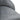 Close-up of gray upholstered seat cushion texture on a tufted dining chair