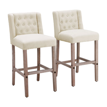 Pair of light cream linen bar stools with button-tufted backs and wooden legs