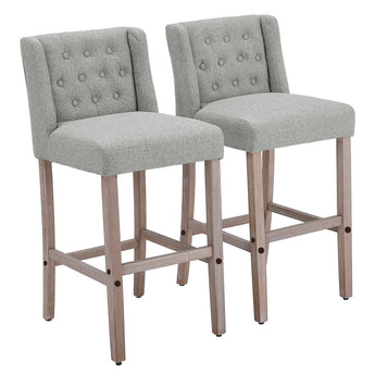 Pair of gray linen bar stools with button-tufted backs and wooden frames