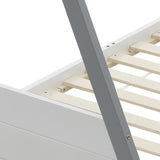 Corner view of the slatted pine base inside the white side panel of the bed