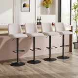 Swivel bar stools with light grey fabric seats, black bases and footrest rings