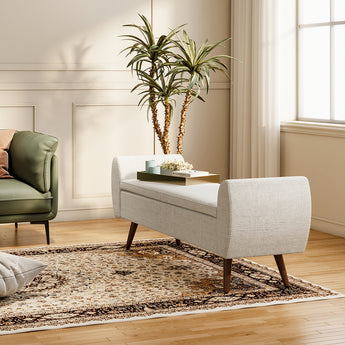 Beige upholstered storage bench with padded top and wooden legs