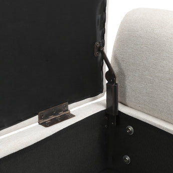 Beige linen storage bench interior with black hinge hardware and latch