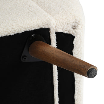 Wooden support leg and hinge detail on faux fur storage bench