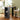 103 cm bar table with light wood top and dark open shelves on both sides