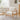 Wooden armchair with teddy-bear-fur upholstery, angled view of seat and back