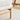 Close-up of teddy-bear-fur armchair arm and wooden side frame