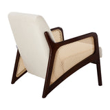 Cream corduroy armchair with rattan armrests, dark wood frame, wide seat and tall back