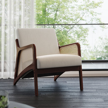 Grey corduroy armchair, rattan armrests and dark wood sides, wide seat and tall back