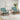 Two green corduroy armchairs with rattan armrests and dark wood sides, wide cushioned seats
