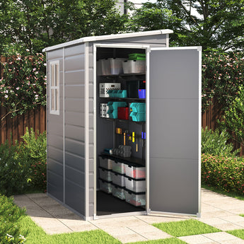 Gray plastic garden storage shed with lockable side door, pent roof, visible interior shelves