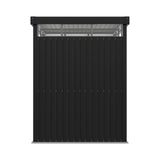 Metal storage shed wall with flat roof overhang, dark gray vertical panel siding and open frame