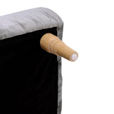 Rectangular velvet footstool corner with tufted padding and wooden leg