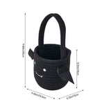 Black woven Halloween treat bucket with handle and spooky face accents
