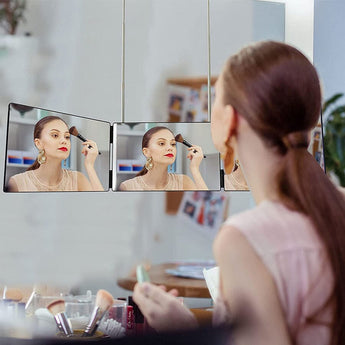 Tri-fold hanging makeup mirror showing multiple angle panels, black frame