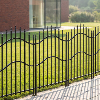 Black metal decorative garden fence panel with arched wavy top and spear finials