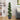Artificial boxwood spiral topiary with dense dark-green leaves in a dark gray planter