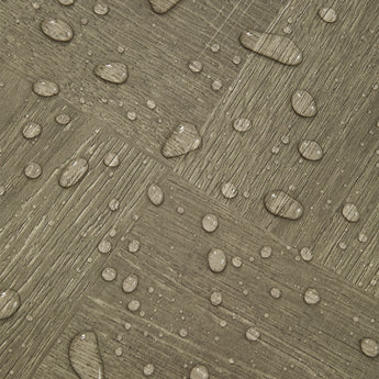Waterproof vinyl floor tile with raised drop beads texture on dark gray woodgrain