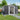 Garden storage shed mit geneigtem Satteldach, geöffnetes Schiebetor, Sicht ins Innere