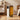 Oil-filled radiator heater with warm-toned fin stack, white body, and rotary control dial