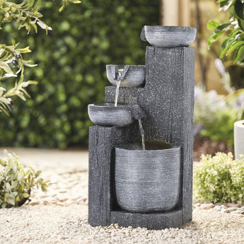 Outdoor solar water fountain decor with stacked rock-style basins, dark gray.