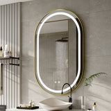 Wall-mounted oval LED bathroom mirror with glowing ring and slim gold frame