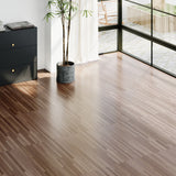 Self-adhesive wood-grain PVC plank flooring in light gray-brown tone