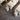 Stone-effect PVC flooring tiles, dark gray stone-look finish under furniture