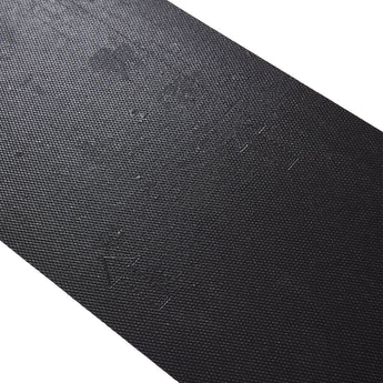 PVC self-adhesive backing sheet with dark textured surface and grid pattern