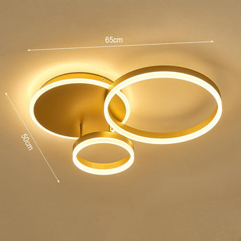 Gold 3-ring LED ceiling light with three circular loops and glowing white LED rings
