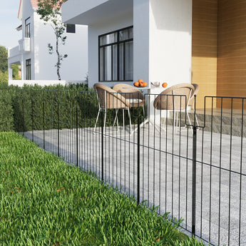 Garden metal fence panels along a yard boundary, black vertical bars
