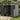 Outdoor tool storage shed with open double doors and side window, gray siding