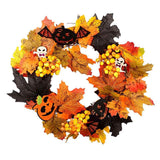 Halloween wreath with orange and black leaves, black bats, pumpkins, and berry clusters