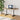 Standing desk frame with black metal legs and base pads under a tabletop