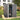 Grey plastic garden storage shed with lockable front door open, showing shelves inside