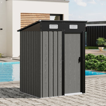 Grey metal garden storage shed corner view with sliding door and vented top panel