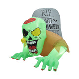 Inflatable green zombie Halloween decoration close-up with RIP panel and red cap