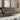 Dark grey linen sofa bed with tufted backrest and rolled seat, chrome legs