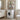 White 2-tier over-washer storage rack with top shelf items above a front-load washer