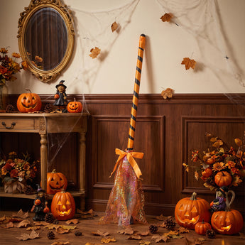 Halloween wand decoration with orange-striped pole and orange patterned tulle pouch