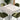 Wood-grain self-adhesive vinyl flooring, light gray planks under a dining table.