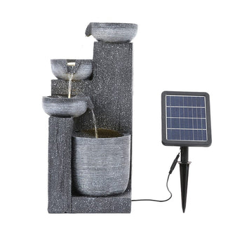 Outdoor solar fountain decor set with dark gray stacked basins and separate solar panel.