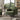 Green chenille accent armchair with tall back, wide arms, and dark wooden legs