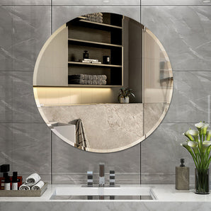 Circular frameless wall-mounted mirror with clear reflective surface
