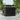 Metal storage shed with flat roof, black corrugated panels, closed double doors