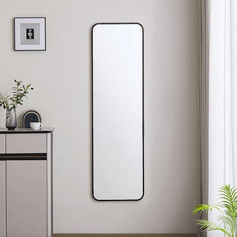 Tall rectangular black metal mirror with rounded corners, slim frame